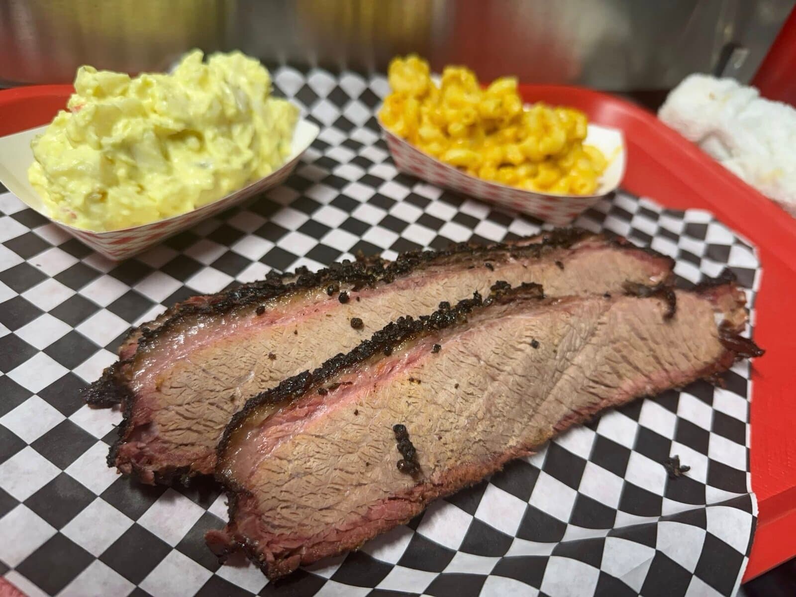 Sliced brisket plate with potato salad and mac n' cheese