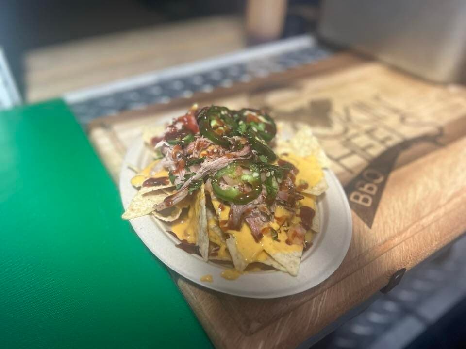 Pulled pork nachos on Smokin' Wheels cutting board
