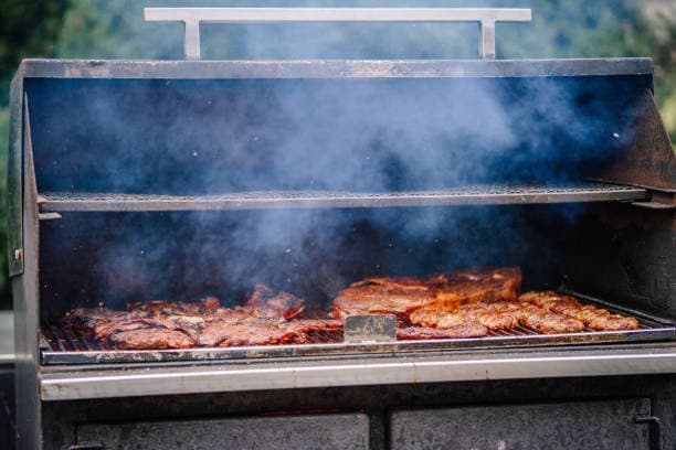 Ribs and chicken loaded in the smoker